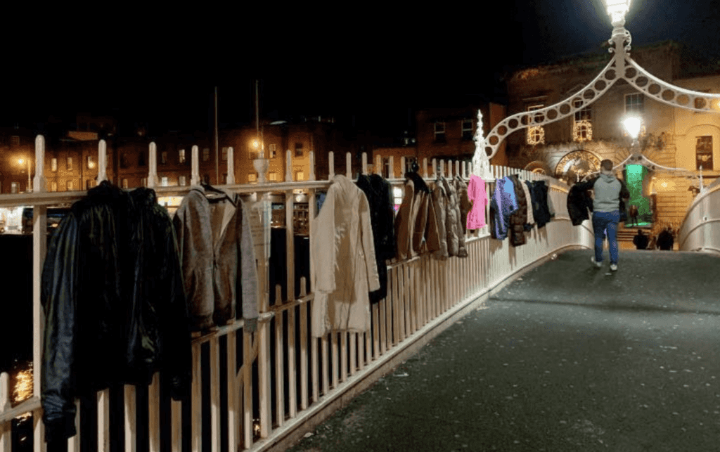 Dublin’s Ha’penny Bridge adorned with donated coats for the homeless