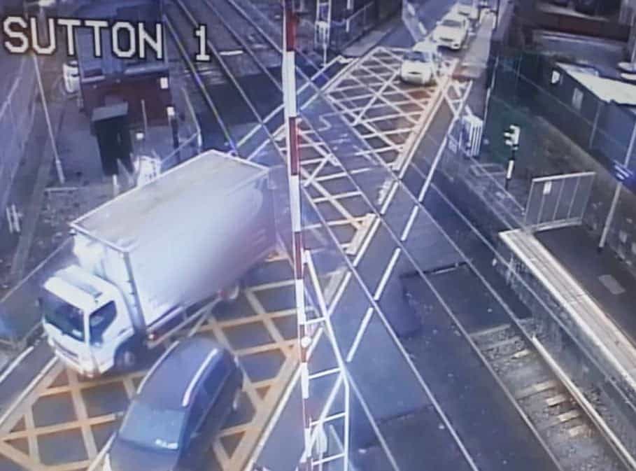 Major delays for commuters this morning after truck smashes through level crossing
