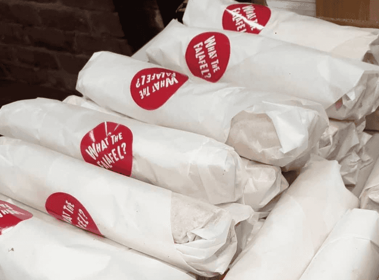 What The Falafel distributing free food to the homeless this evening