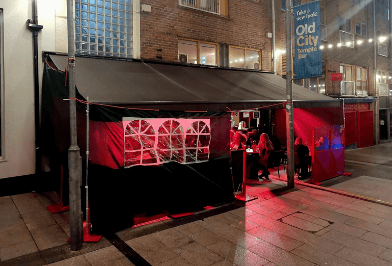 PICS: Dublin wine bar models handy new rain cover PICS: Dublin wine bar models handy new rain cover