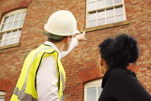 person getting their house surveyed