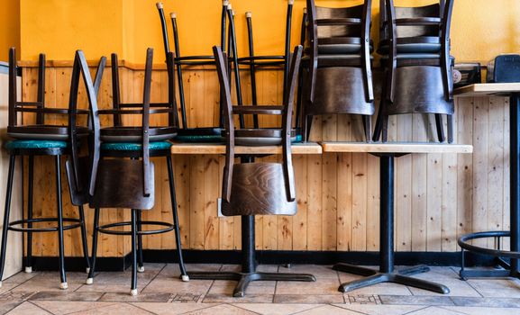 chairs on tables in restaurant