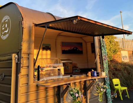 Cheeky Rascal horse box cafe with hatch open on a sunny day